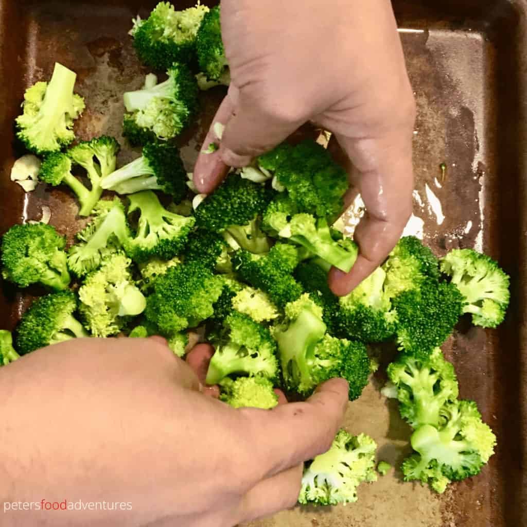 mixing broccoli for roasting