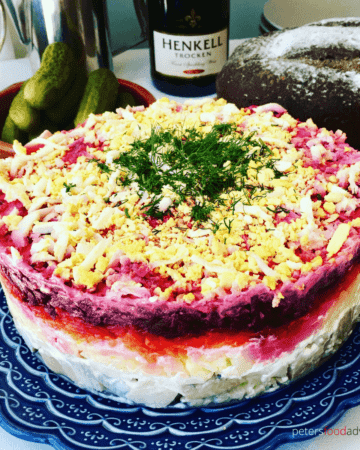 A classic Russian winter recipe, popular especially during New Year celebrations. A layered salad with beets, potatoes, carrots, eggs, herring and lots of mayonnaise! It's like a crazy dressed herring potato salad! - Herring Under a Fur Coat