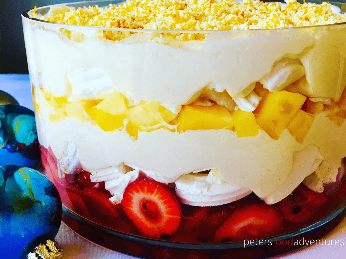 Super easy trifle recipe, a modern trifle, without the boring stuff! Meringue, cream, passionfruit, mangoes and strawberries, topped with white chocolate - heaven in a bowl! A holiday favorite - Pavlova Trifle Recipe