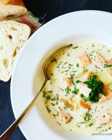 bowl of creamy salmon soup with a spoon