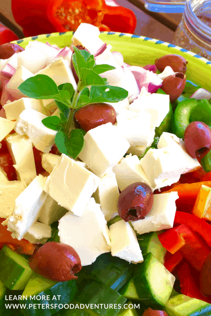 This traditional Cucumber Greek Salad with Easy Oregano Salad Dressing Vinaigrette! Packed with Feta, Tomatoes, Peppers and Onions, so delicious! Traditional Greek Salad with Easy Dressing Recipe