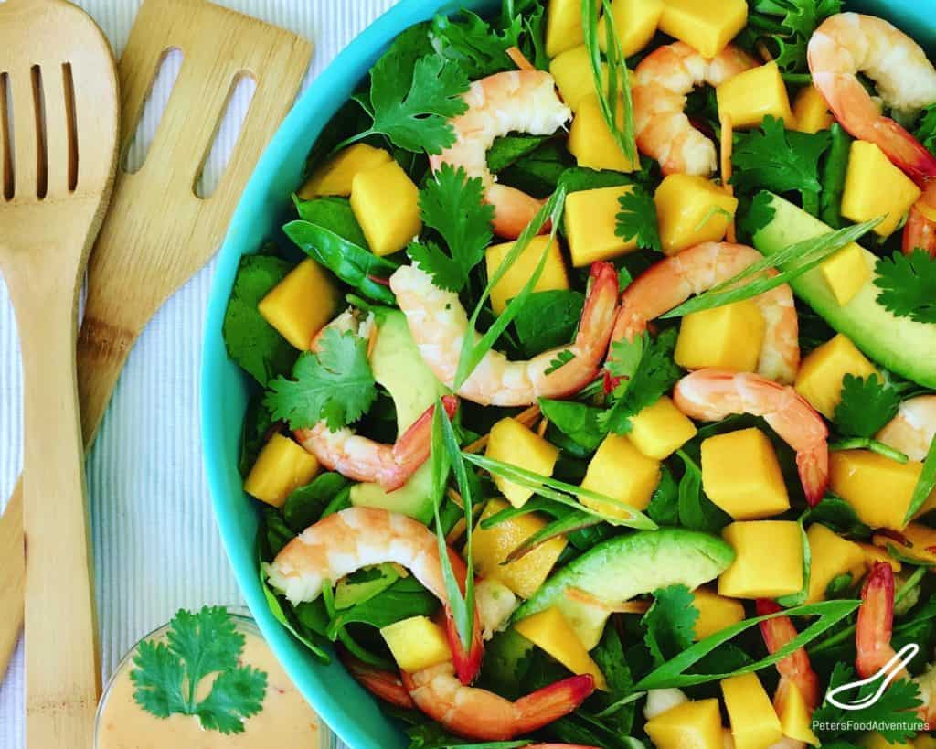 This Shrimp Mango Salad recipe with avocados is delicious, fresh and healthy, can be thrown together very quickly, is fresh, delicious sure to be a summer favorite. Made with an easy creamy Thai Sweet Chili and Lime Dressing - Prawn Mango Salad