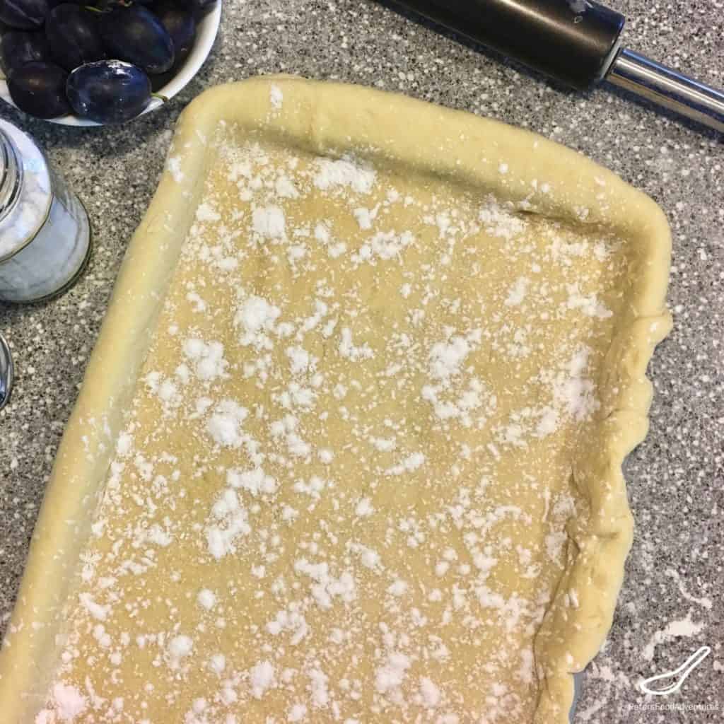 pie pastry dough over a baking pan