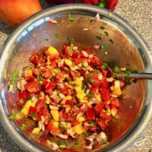 The ultimate summer recipe, easy to make and delicious. Bbq grilled chicken with fresh mango, tomatoes, jalapeños, peppers and cilantro - Grilled Chicken with Mango Salsa