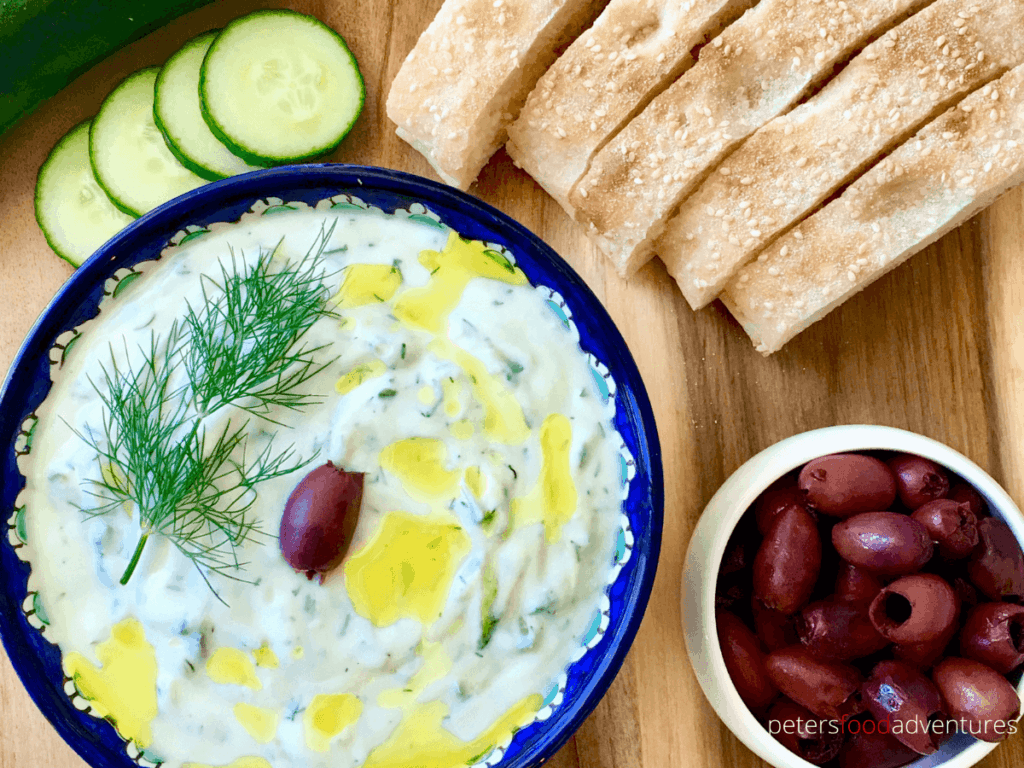 An authentic Tzatziki sauce recipe that's easy to make and tastes delicious. Perfect as a Meze Dip or with a Souvlaki. Made with Greek yogurt, garlic, dill and cucumbers, its a Mediterranean classic.