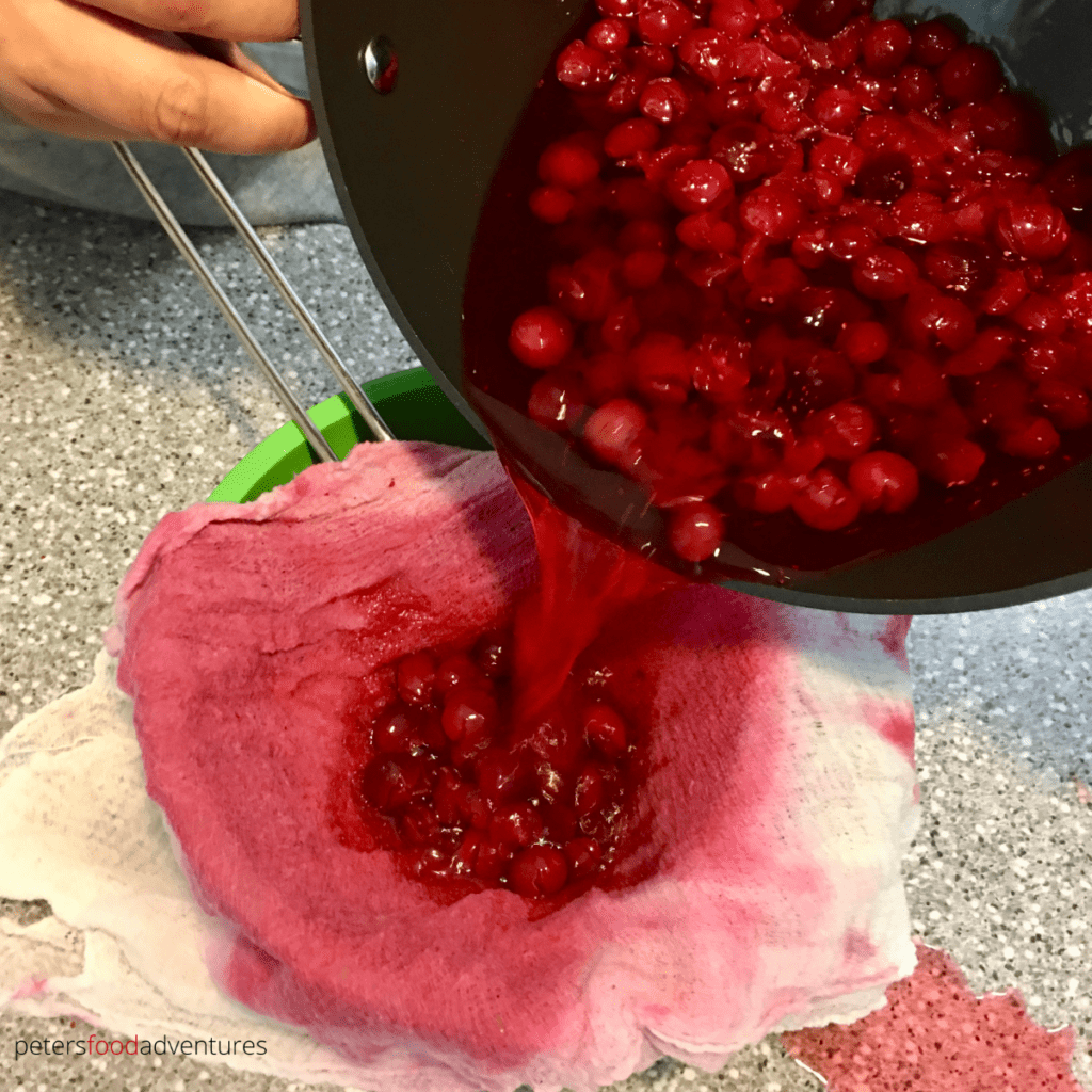 straining cranberry juice