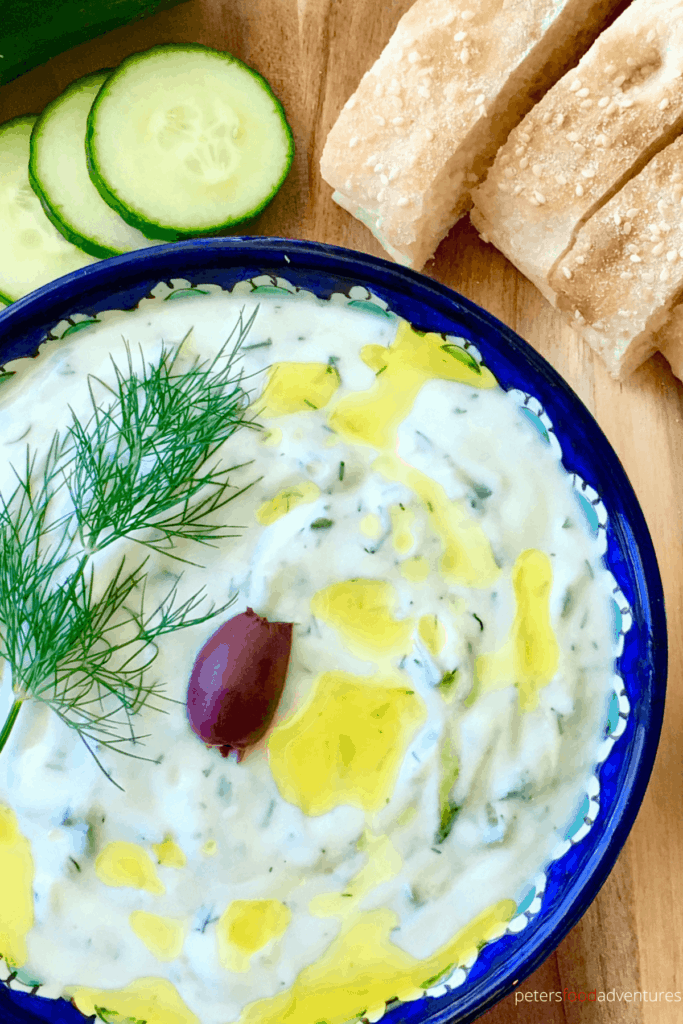 An authentic Tzatziki sauce recipe that's easy to make and tastes delicious. Perfect as a Meze Dip or with a Souvlaki. Made with Greek yogurt, garlic, dill and cucumbers, its a Mediterranean classic.
