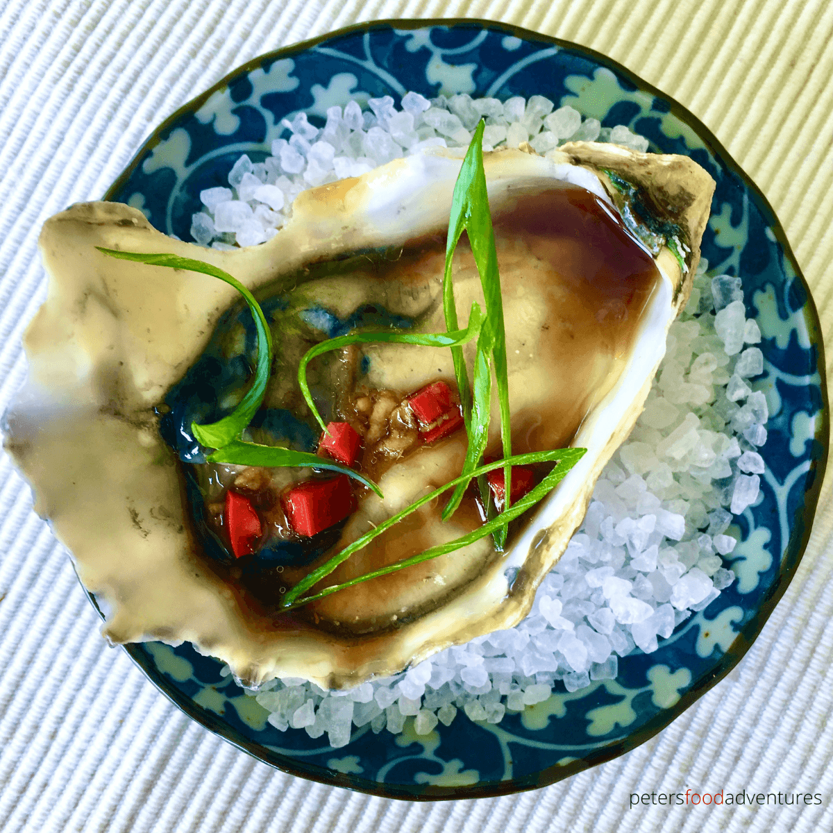 Freshly shucked oysters drizzled with an Asian vinaigrette, with fresh chili pepper and grated ginger. You'll definitely fall in love with my Asian Oyster Dressing!