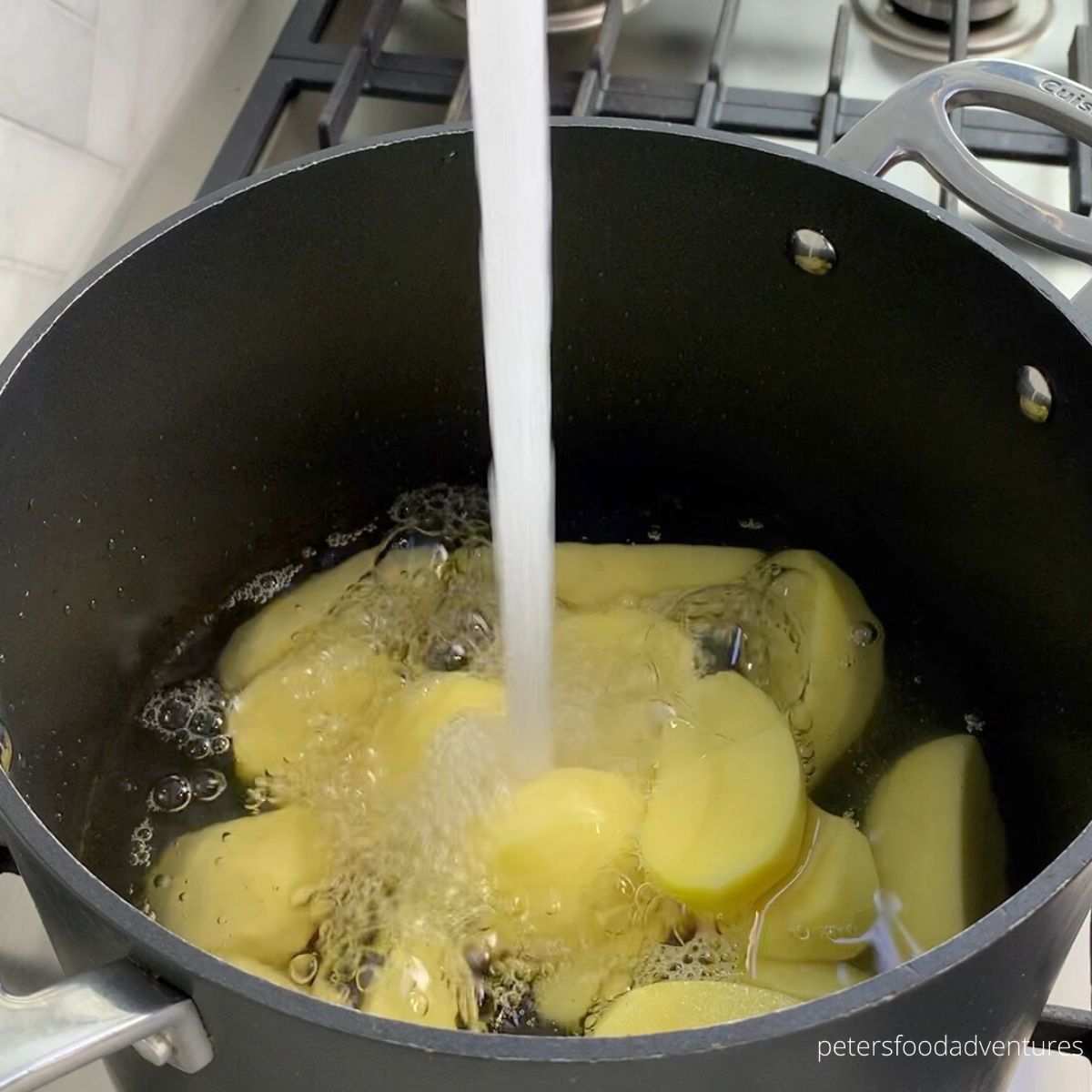 pouring water into potatoes
