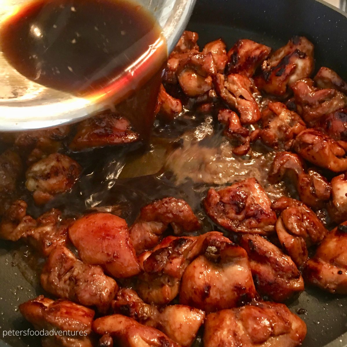 pouring marinade over chicken
