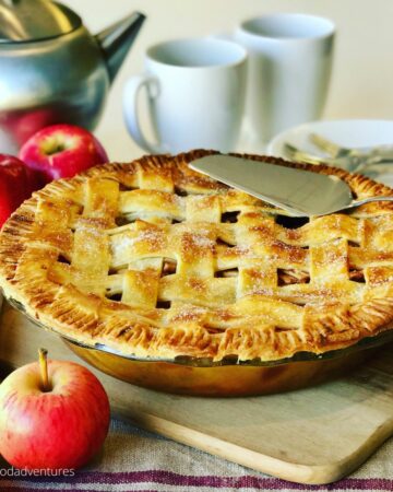 apple pie with lattice crust on a table