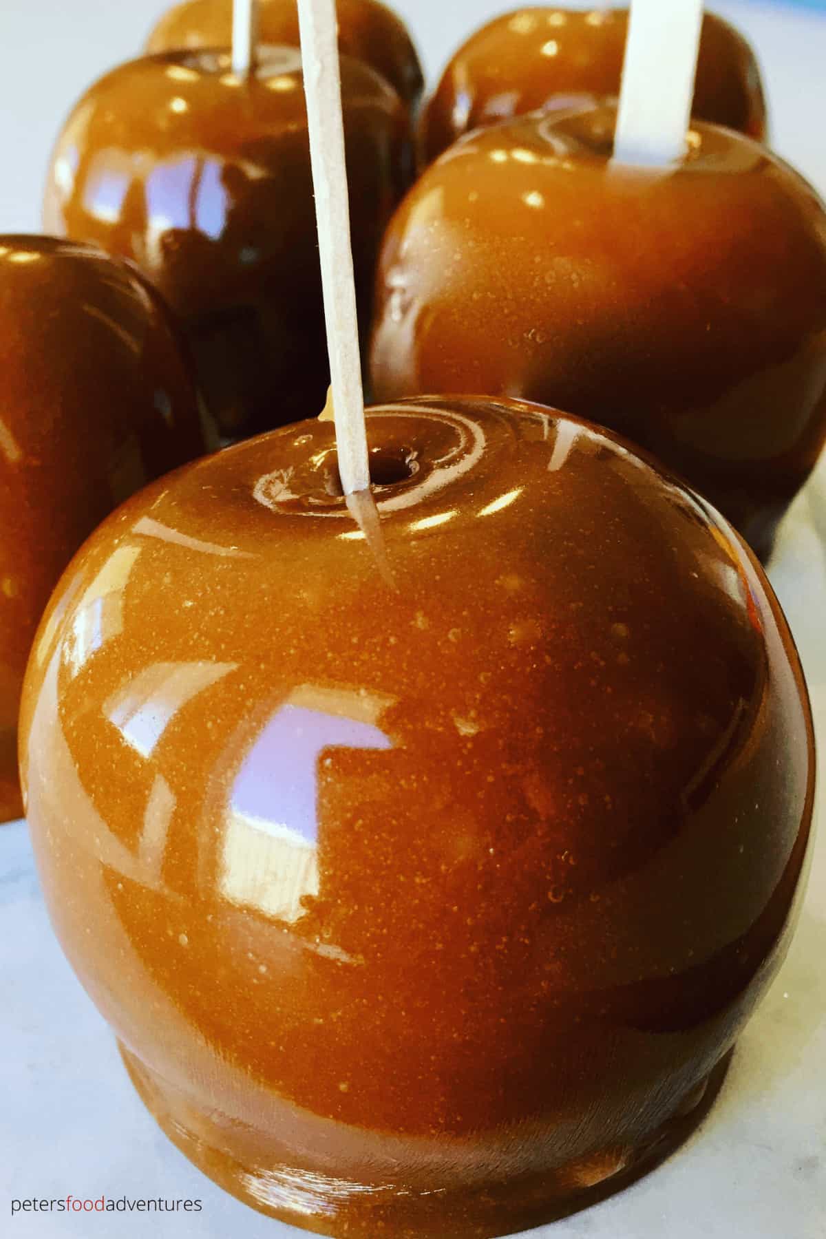 Caramel Apples are a family autumn favorite, perfect for halloween and parties. An easy fall classic the whole family will love - Kraft Caramel Apples