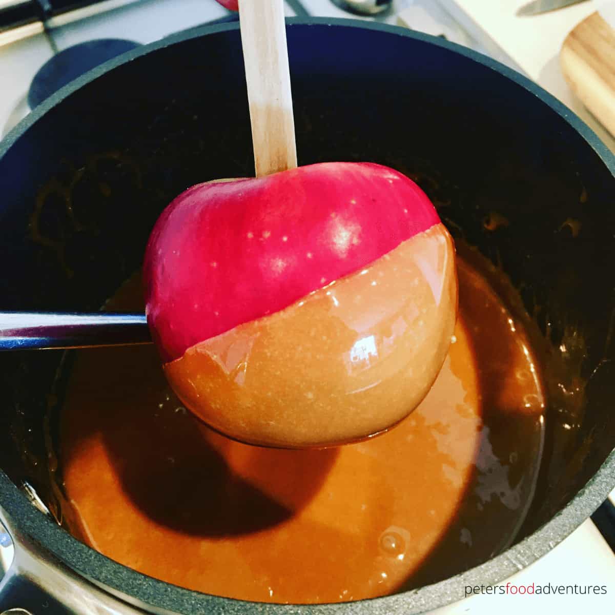 red apple dipped in caramel sauce