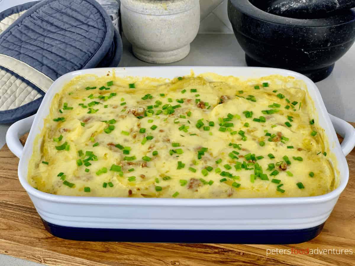 Potato Bake with French Onion Soup is creamy, cheese scalloped potato casserole that only uses 4 ingredients. So easy to make, yet packed full of flavor