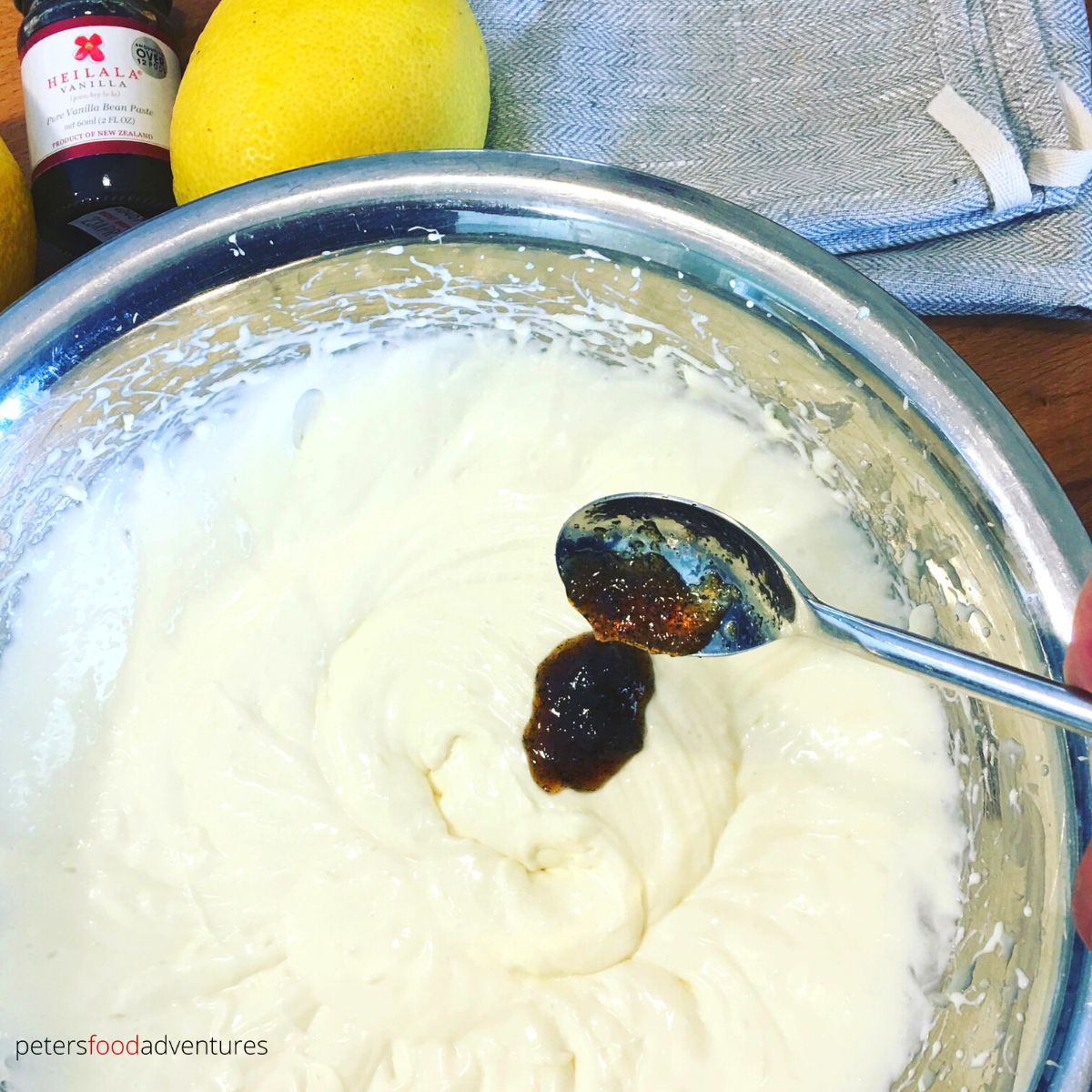 mixing vanilla into cream cheese