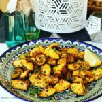 Moroccan Roasted Potatoes are so easy to make. A perfect side dish of crispy roasted potatoes, jam packed with spices like cumin, paprika, turmeric and optional spicy Harissa! No par-boiling, just crispy roasted on a baking sheet or Air Fryer, perfect with your roast chicken dinner or a tagine meal!