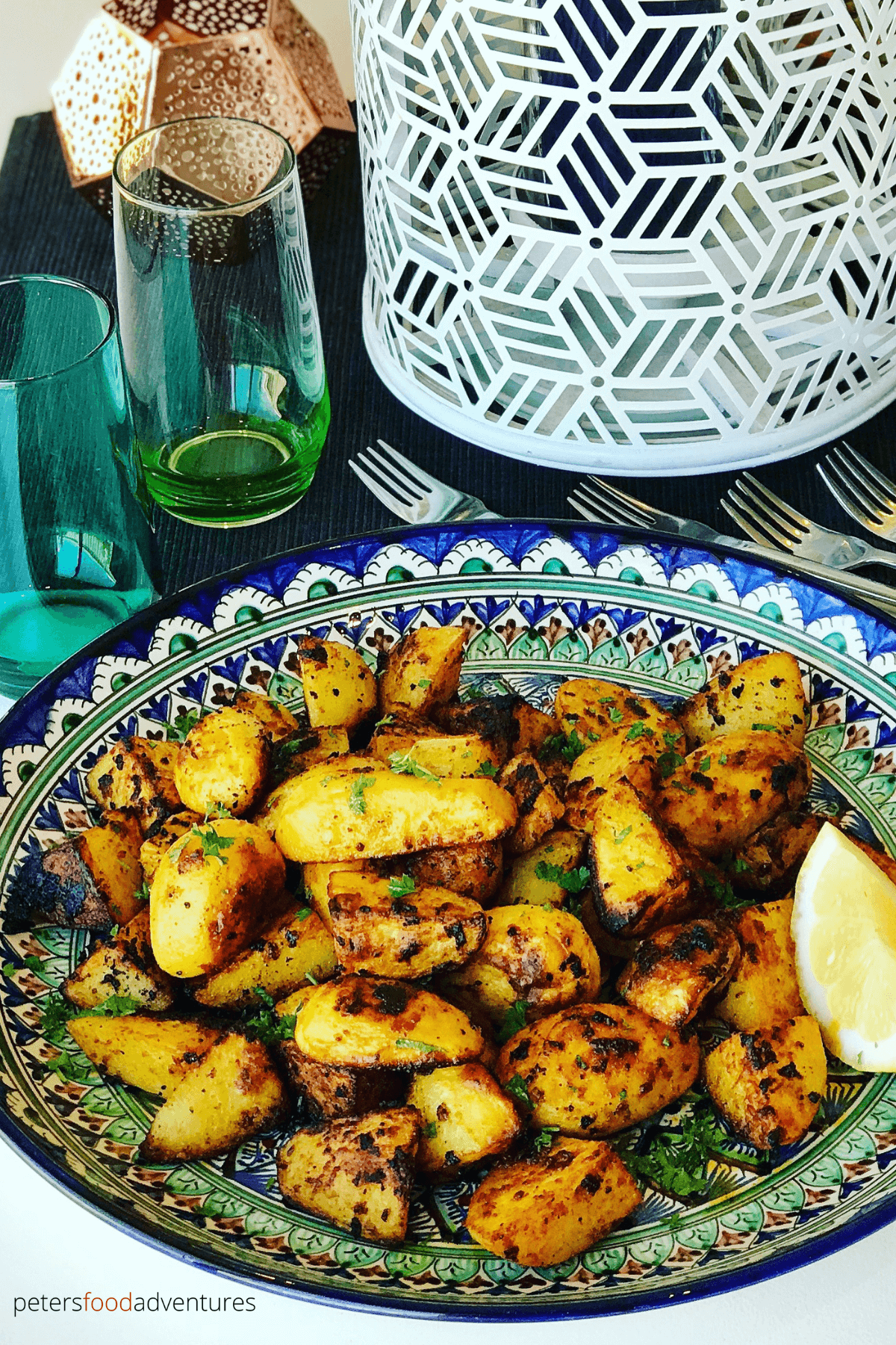 Moroccan Roasted Potatoes are so easy to make. A perfect side dish of crispy roasted potatoes, jam packed with spices like cumin, paprika, turmeric and optional spicy Harissa! No par-boiling, just crispy roasted on a baking sheet or Air Fryer, perfect with your roast chicken dinner or a tagine meal!