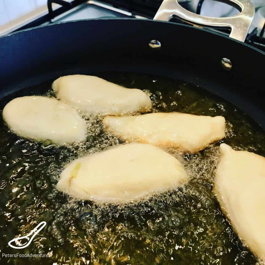 Frying Piroshki in oil in a frying pan