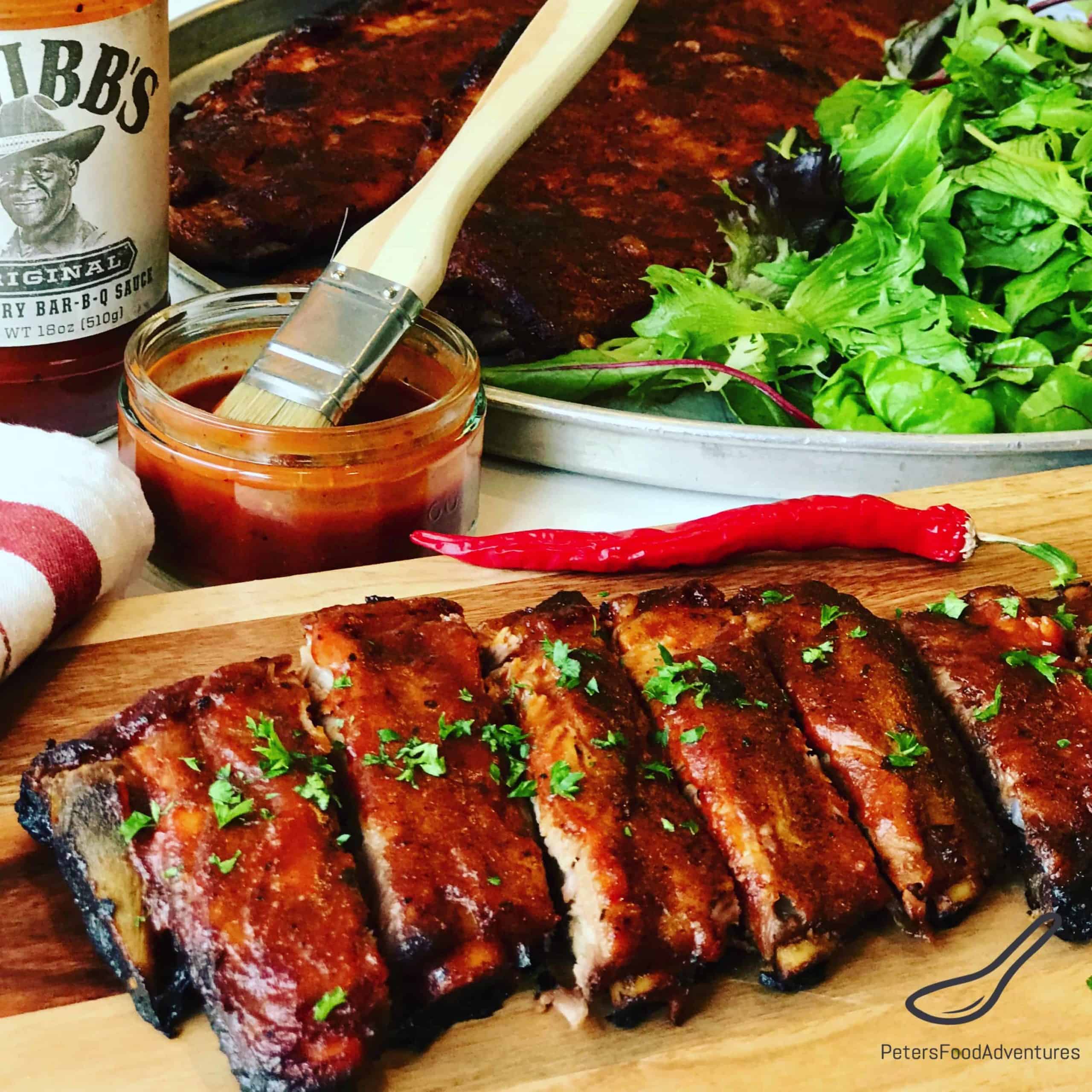 Fall off the Bone Ribs recipe, Ribs in oven that's easy to make with a dry rub, so tender, basted with a perfect blend of Honey Sriracha Bbq sauce. Finger licking good!