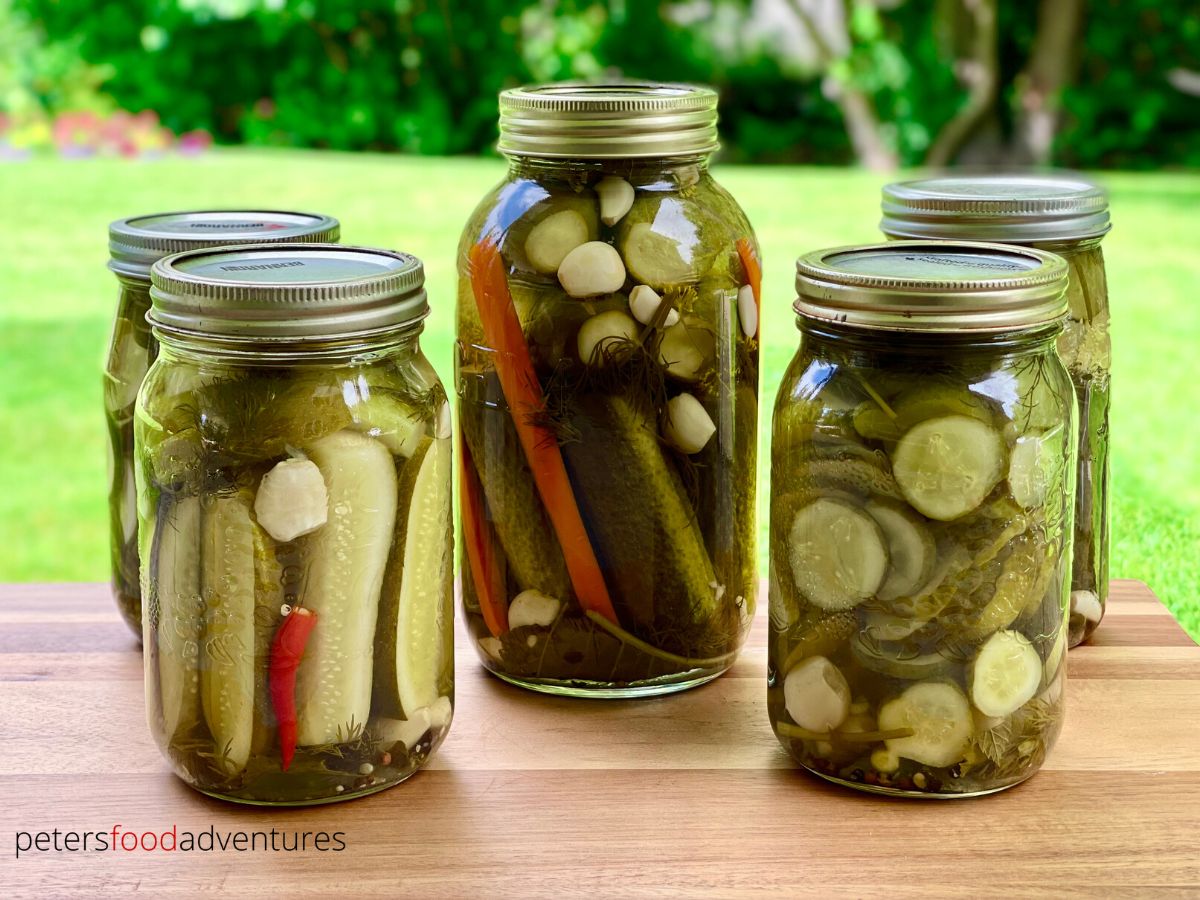 5 pickle jars outside on table