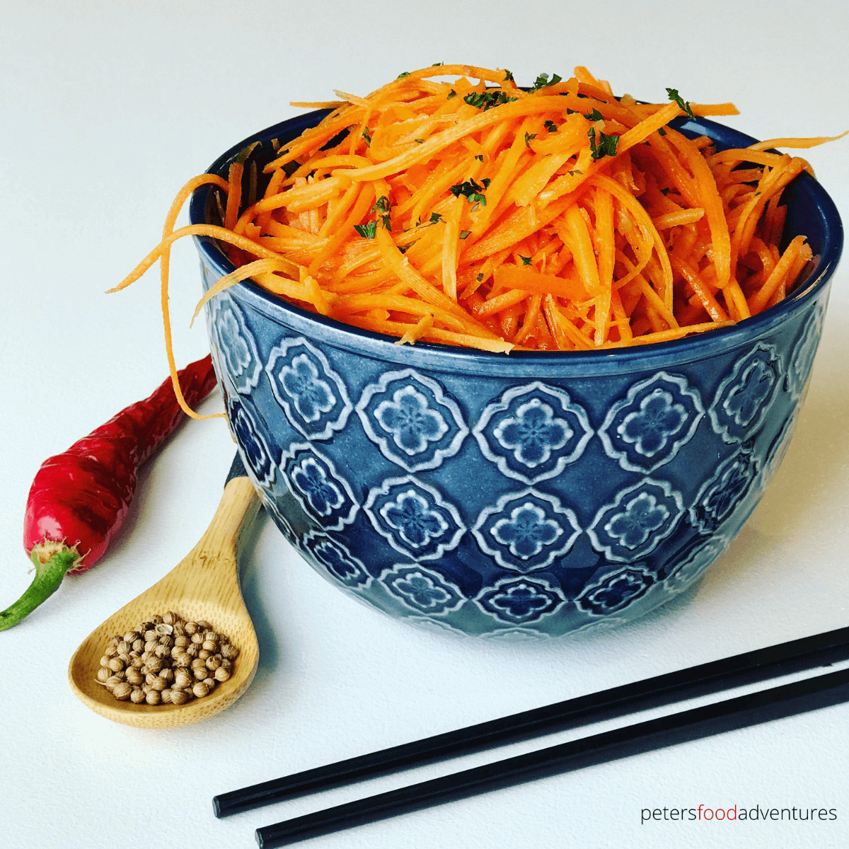 An easy Carrot Salad recipe from Russia called Morkovcha, with roots of Korean immigrants. Thinly julienned carrots with garlic, vinegar, spices and onions in hot oil. A family favorite. (Морковь по-корейски)