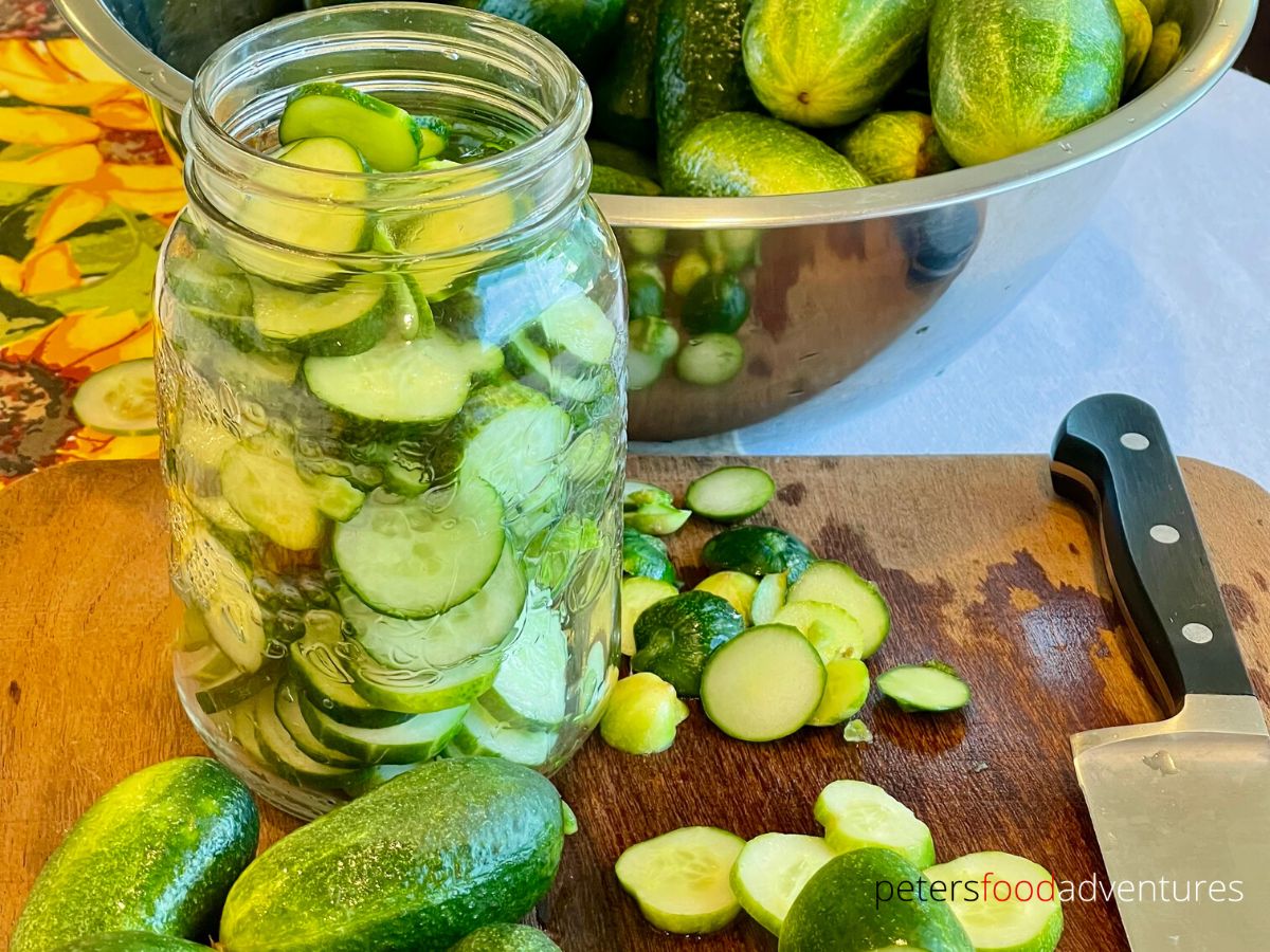 stuffing sliced pickles into jar