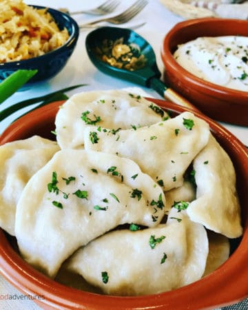Vareniki Dumplings with Farmer's Cheese Tvorog. A comfort food popular in Russia, Ukraine and Eastern Europe. Known as Perogies, Pierogi, Pirohy and more... Slather generously with butter and sour cream.