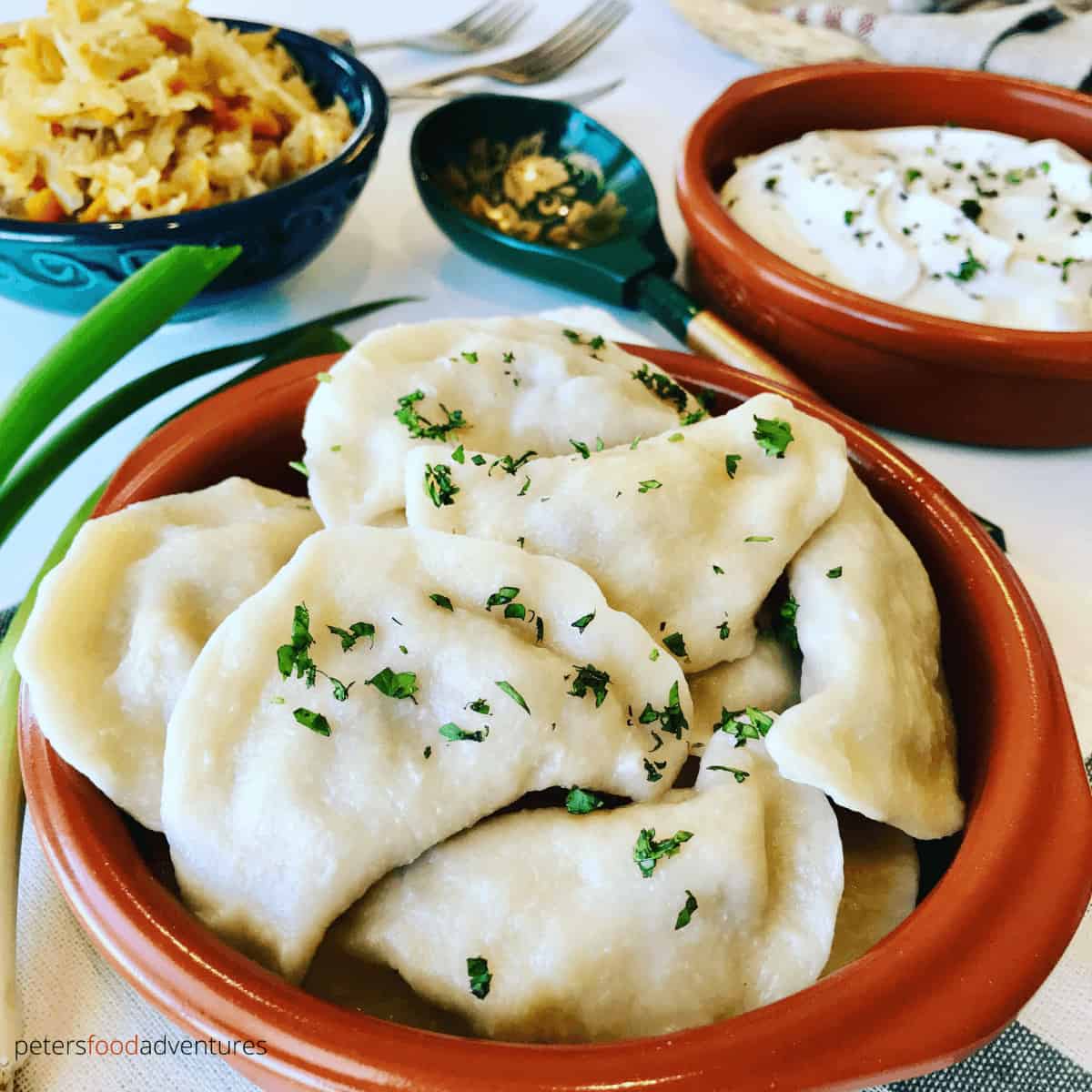 Vareniki Dumplings with Farmer's Cheese Tvorog. A comfort food popular in Russia, Ukraine and Eastern Europe. Known as Perogies, Pierogi, Pirohy and more... Slather generously with butter and sour cream.