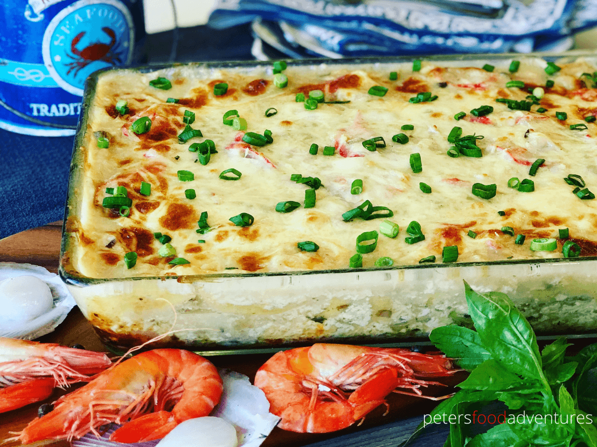 This Easy Seafood Lasagna is made with mushroom soup, white wine, shrimp, scallops and imitation crab. Rich and creamy family dinner favorite.