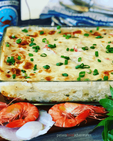 This Easy Seafood Lasagna is made with mushroom soup, white wine, shrimp, scallops and imitation crab. Rich and creamy family dinner favorite.