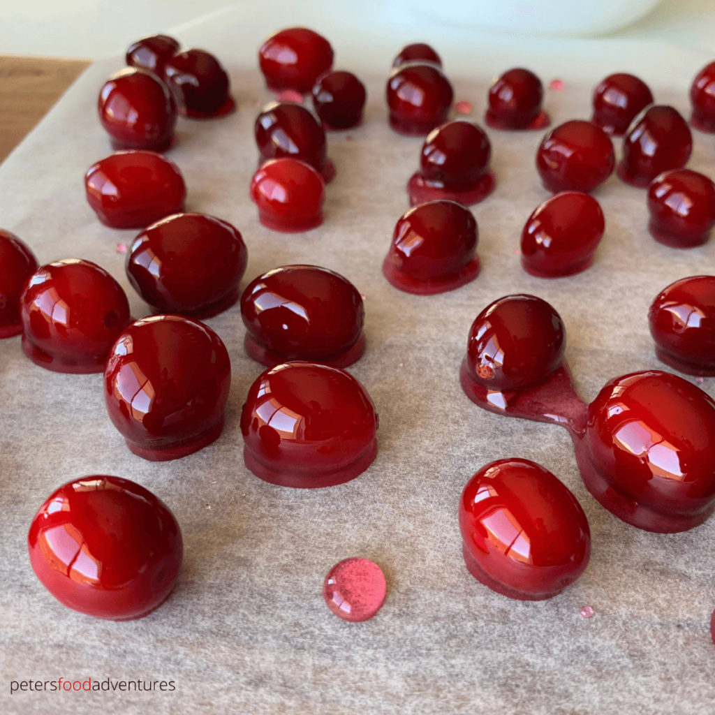 sugared cranberries drying on baking paper