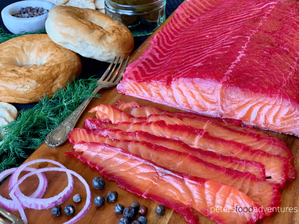 Bright Pink Salmon Gravlax is easier to make than you think! Only 5 minutes of prep time with a few days in the fridge to cure. Made with beets, salt, dill, juniper berries and vodka. Cured Salmon also known as Beetroot Gravadlax, is an amazing appetizer or perfect for breakfast with bagels and cream cheese.