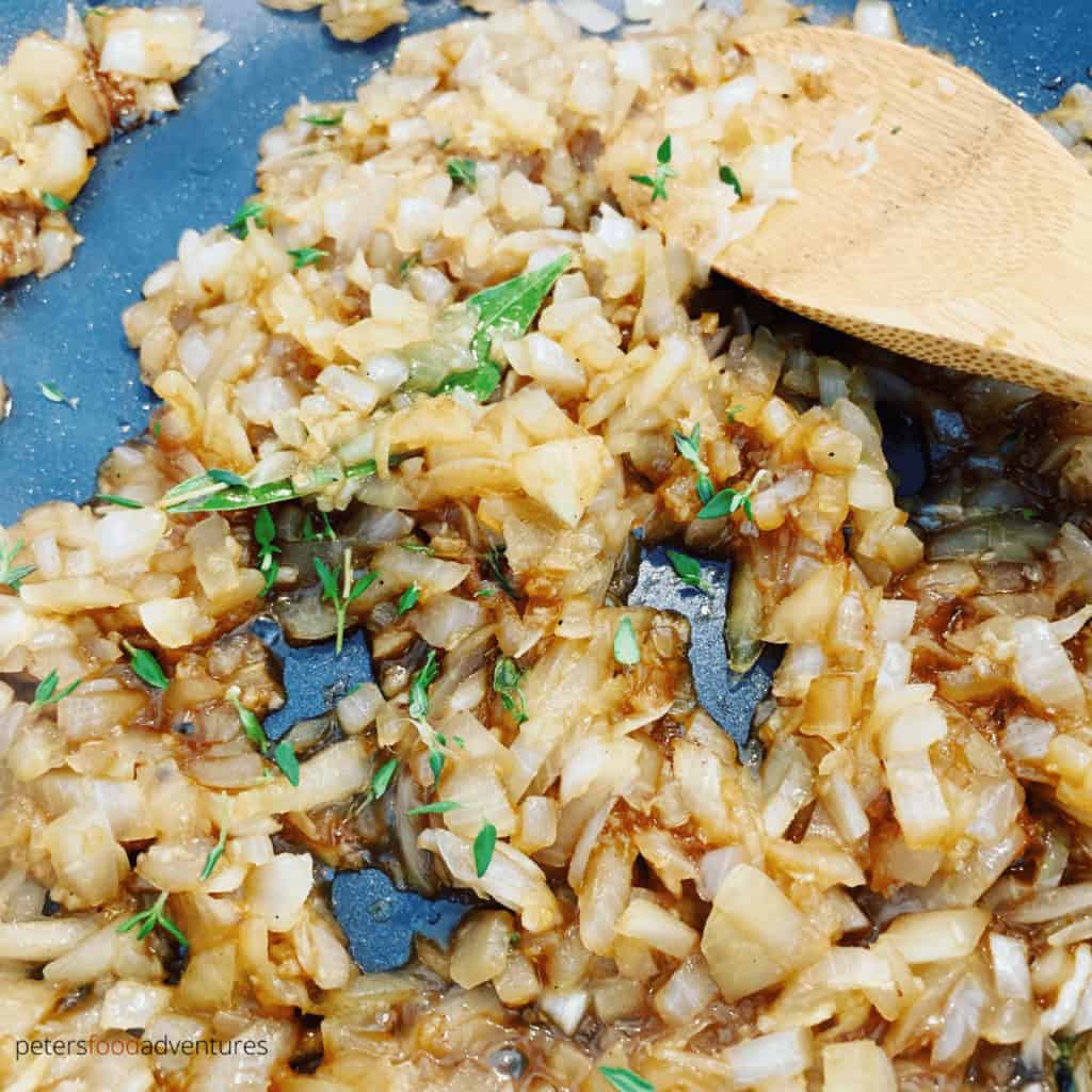caramelizing onions in a frying pan