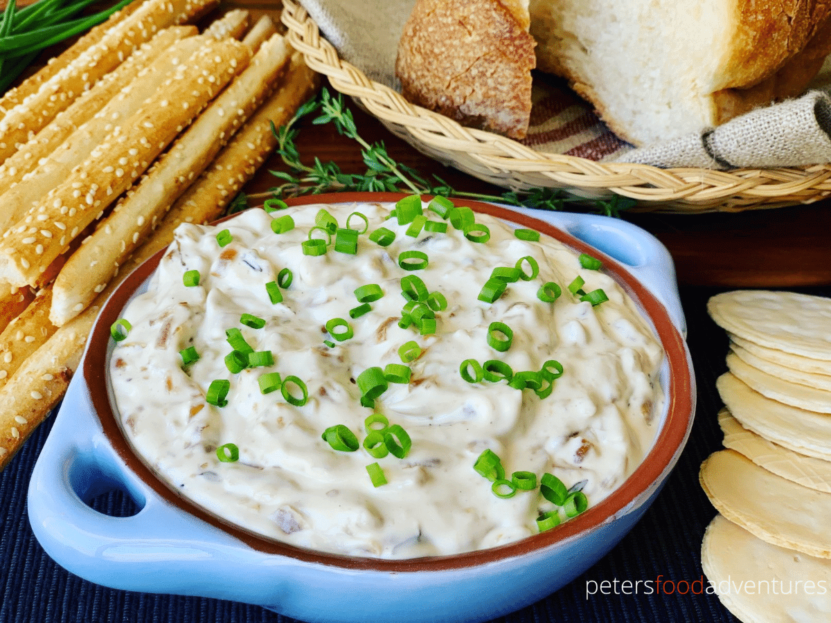 french onion dip in a bowl with crackers