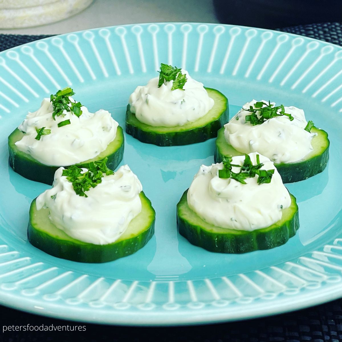 Cucumber Bites with Herbed Cream Cheese on a plate