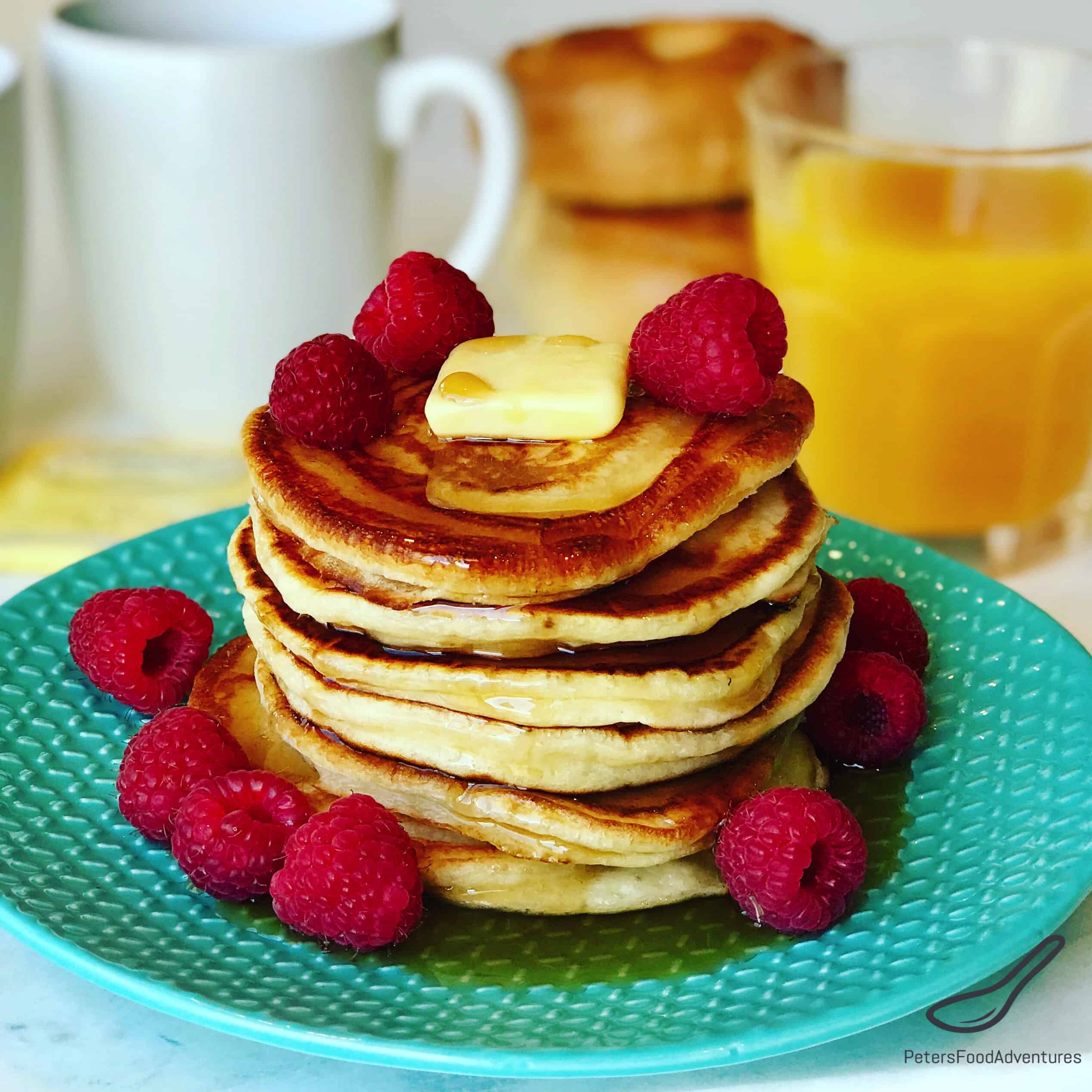 Fluffy Buttermilk Pancakes stacked high. The perfect breakfast drenched in maple syrup, your whole family will love this tasty recipe!