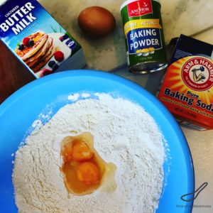 Buttermilk Pancake ingredients in bowl with cracked eggs