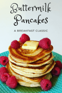 Buttermilk Pancakes stack with fresh raspberries and syrup