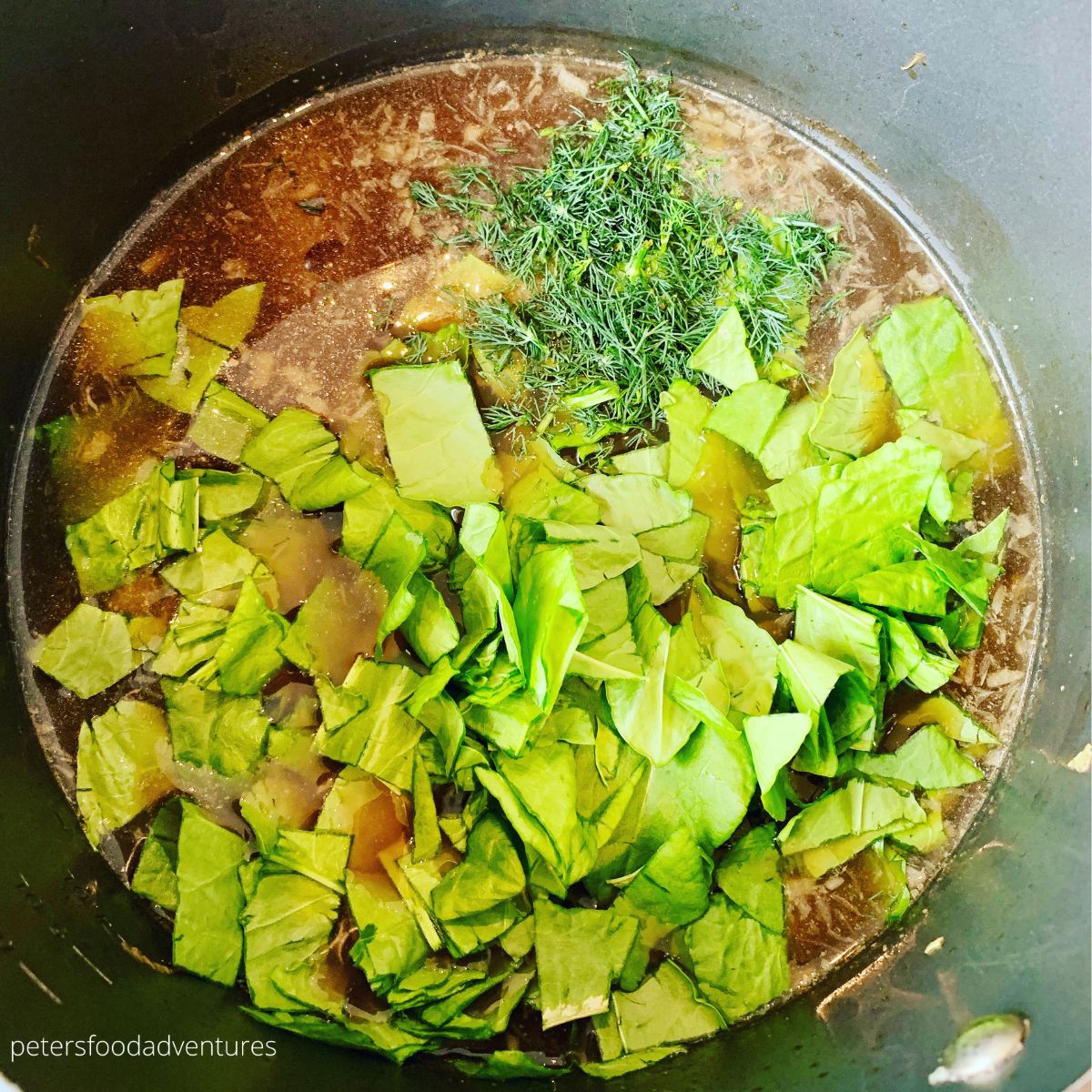 making green borscht in a pot