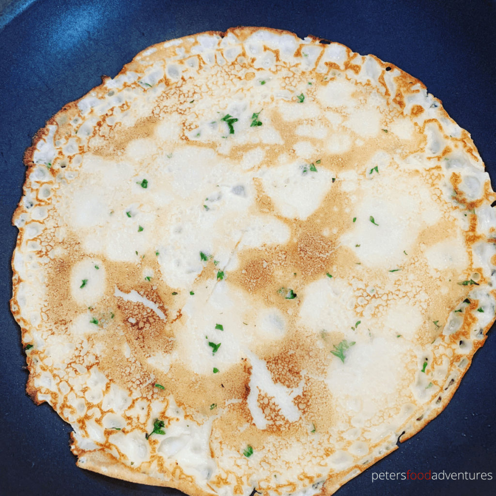 cooking blini in a frying pan