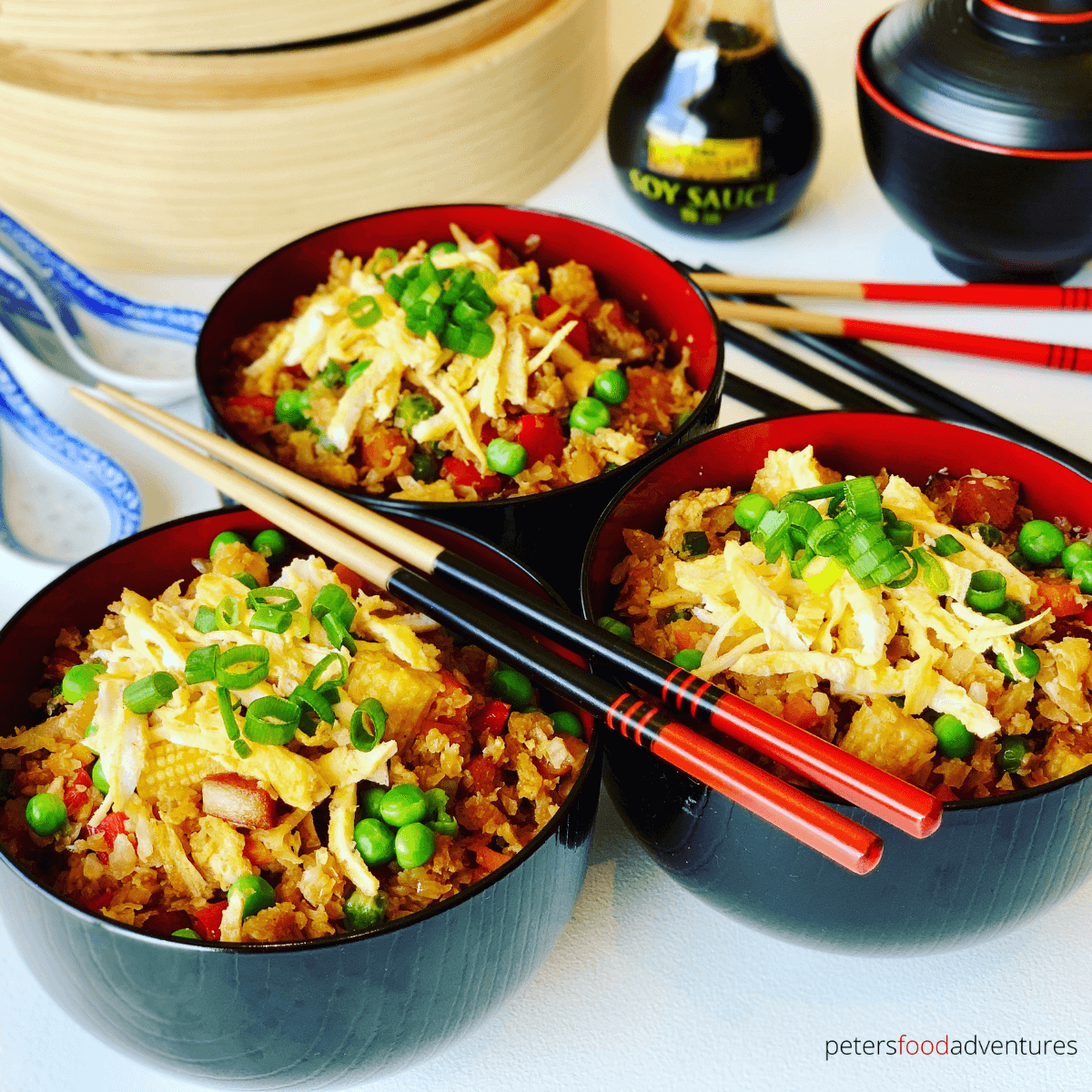 Cauliflower Fried Rice recipe is low carb, keto and delicious. An easy way to sneak in vegetables to your dinner plate. Perfect as a side dish, or as your dinner main. Packed with classic fried rice vegetables like red peppers, peas, carrot and baby corn.