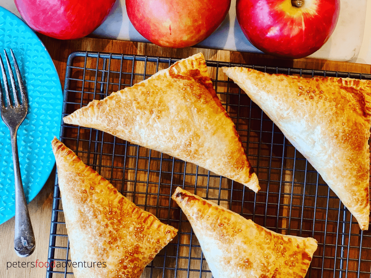 Apple Turnovers with Puff Pastry are an autumn favorite, easy to make apple hand pies. Perfect way to use up apples during harvest. Made with puff pastry, freeze them for later, or drizzle them with a cream cheese icing. Perfect for breakfast or for dessert!