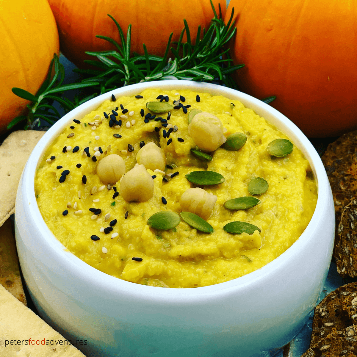 Easy Pumpkin Hummus is healthy appetizer and perfect for fall or Thanksgiving. Made in minutes, with pumpkin, chickpeas, garlic and rosemary. A vegan savory dip that everyone will enjoy.