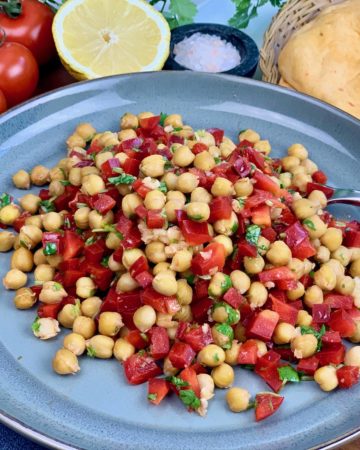 A delicious Chickpea Salad, roasted for extra flavor. A healthy side dish for your next dinner or picnic, made with red pepper, cilantro and garlic. An easy make ahead salad that's vegan and gluten free.