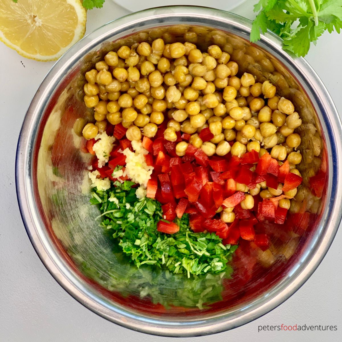 mixing chickpea salad