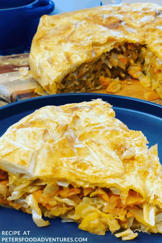 Russian Cabbage Pie that is easy to make using a puff pastry shortcut. Stuffed with butter braised cabbage. A tasty vegetarian meal that’s perfect for lunch or dinner!