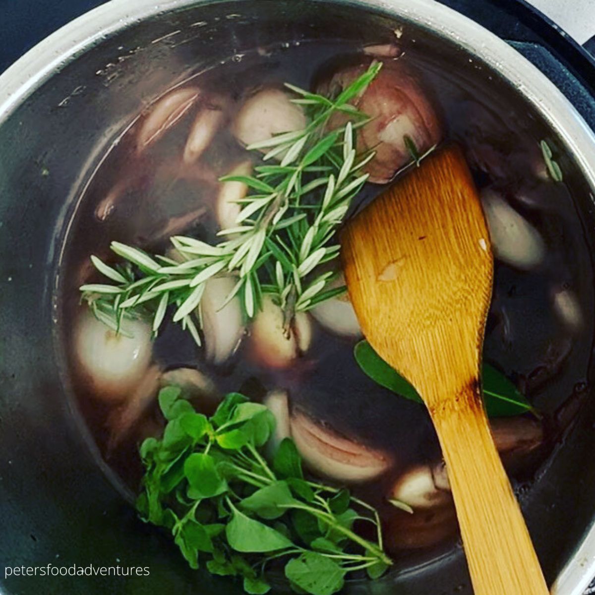 herbs and stock in a pot