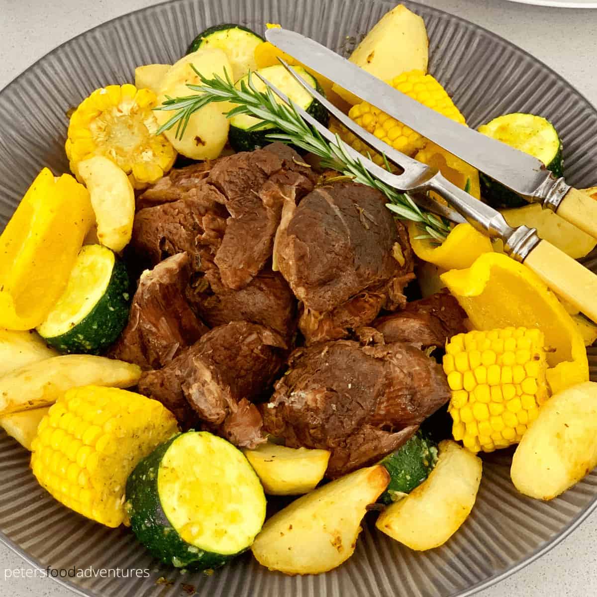 A foolproof Greek Instant Pot Lamb recipe with rosemary, garlic, oregano, thyme, lemon and red wine. An easy pulled lamb or tender roast dinner recipe, a pressure cooker favorite with a lamb gravy recipe!