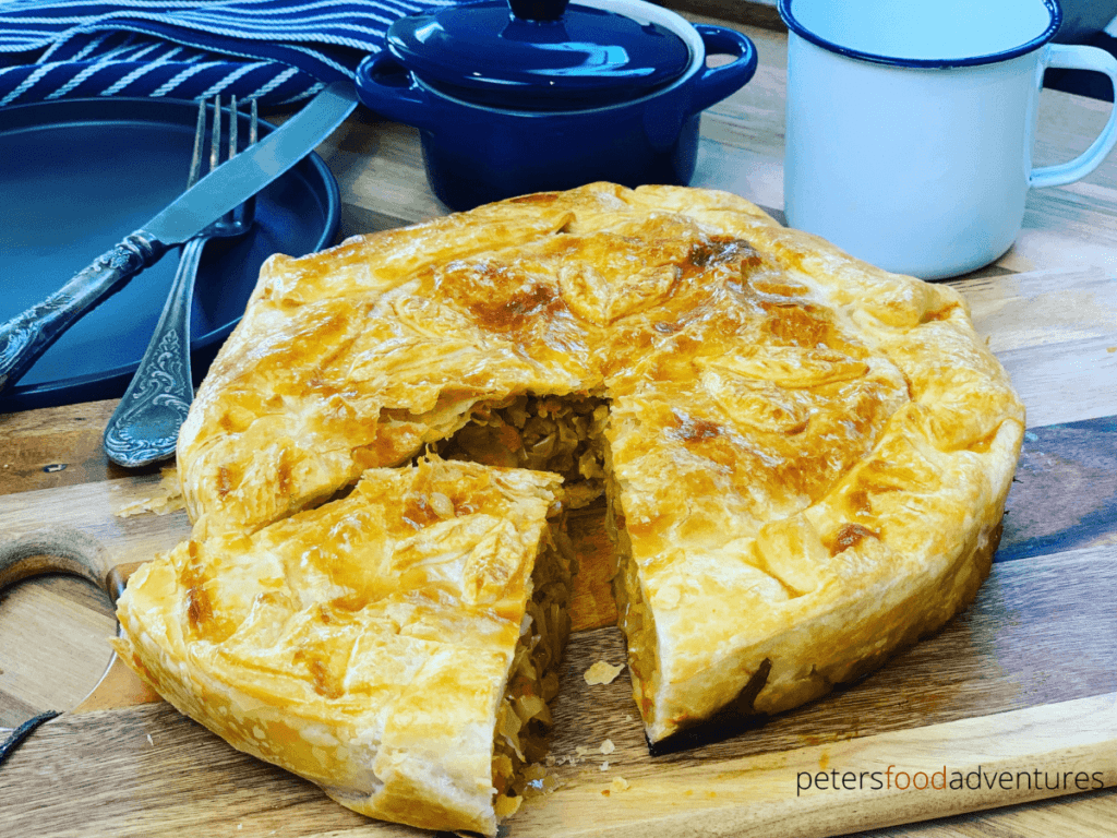A Russian Cabbage Pie that is easy to make using a puff pastry shortcut. Stuffed with butter braised cabbage. A tasty vegetarian meal that’s perfect for lunch or dinner!