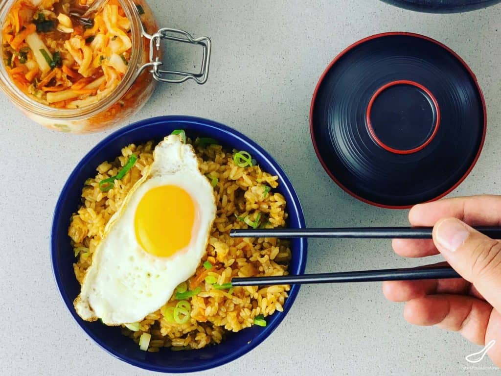 A Kimchi Fried Rice recipe that will feed a family. Made with chicken, but often made as a vegetarian recipe. So easy to make, packed with flavor, and can be done in 30 minutes. You want want boring fried rice after eating this delicious recipe! Kimchi Bokkeumbap.